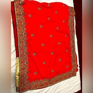 Beautiful wedding saree red orange with blouse size medium. Never worn, OBO
